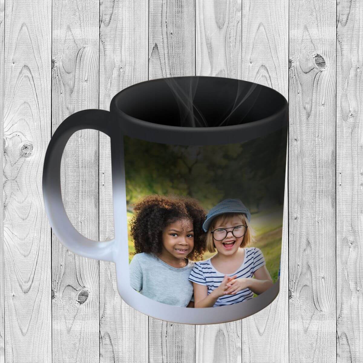 Colour-changing-ceramic-mug-personalised-kids-in-park-grey-wood-bgnd